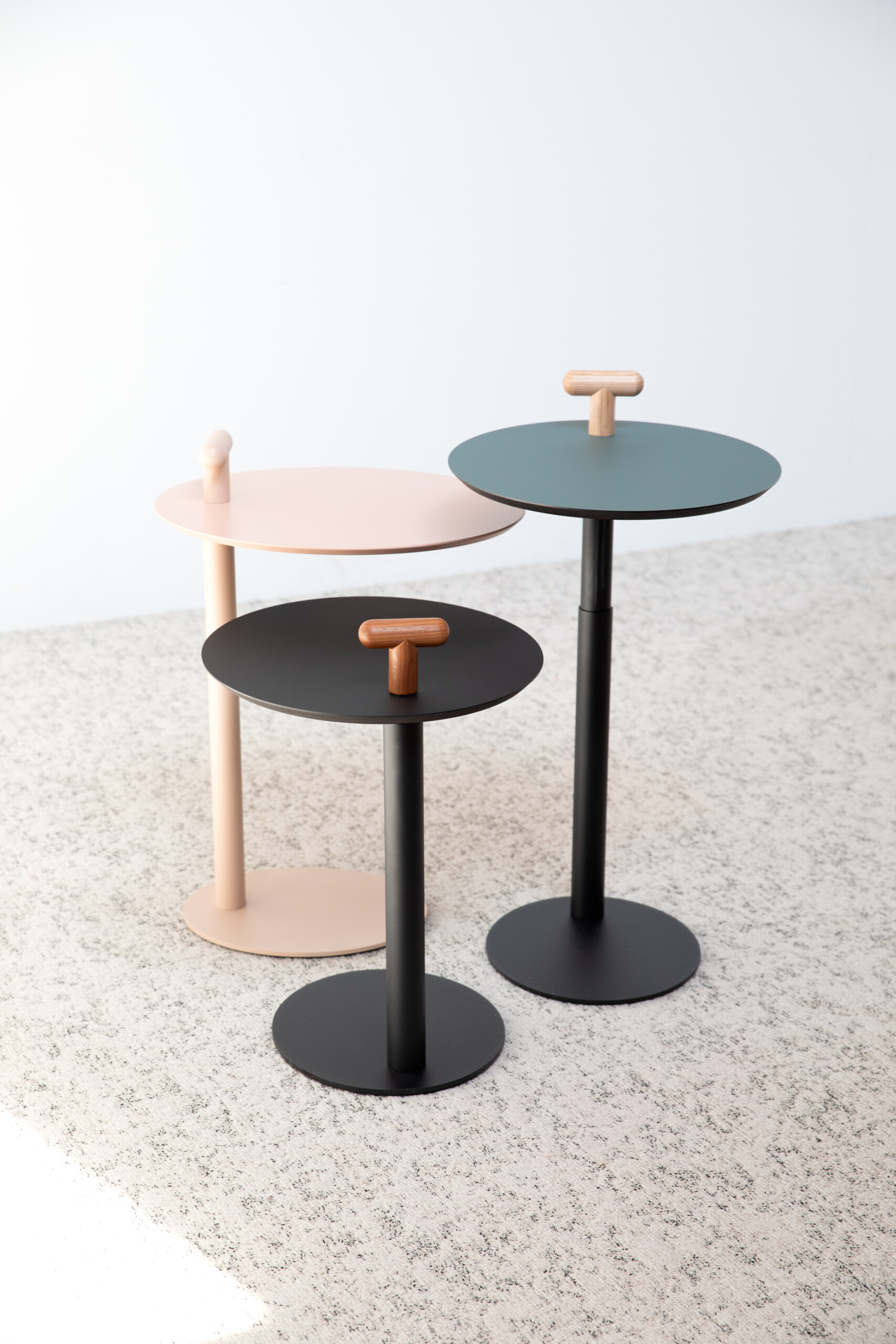 Bulo Lucca by Gensler: Compact side table with adjustable wooden handle and fixed-height monochrome options.